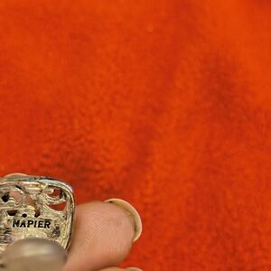 Silvertone Napier brain clip on earrings.